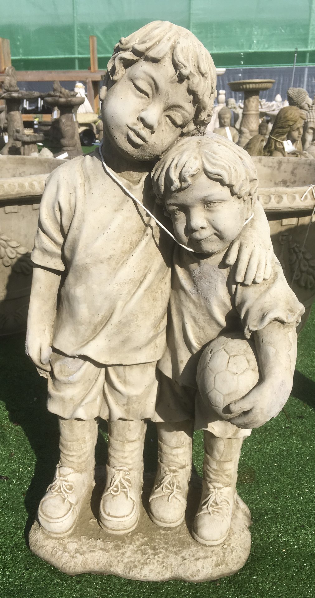 Two little footballers stone ornament